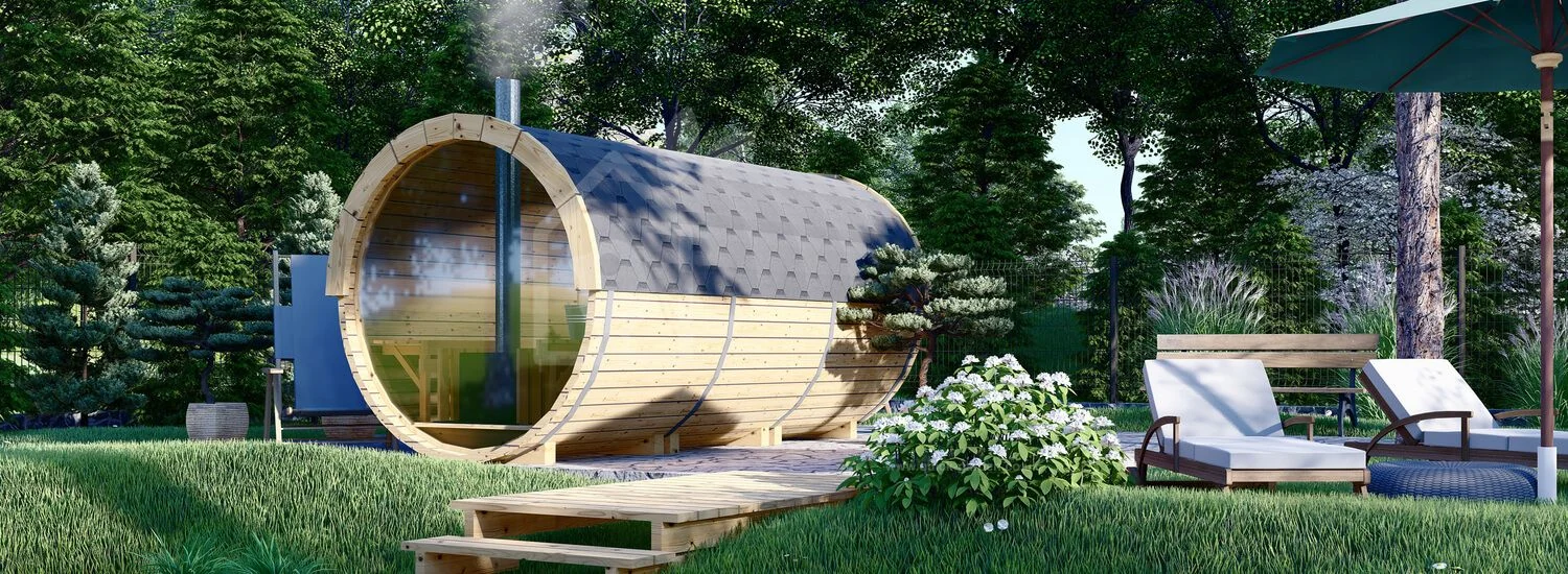 Outdoor barrel sauna in a landscaped setting
