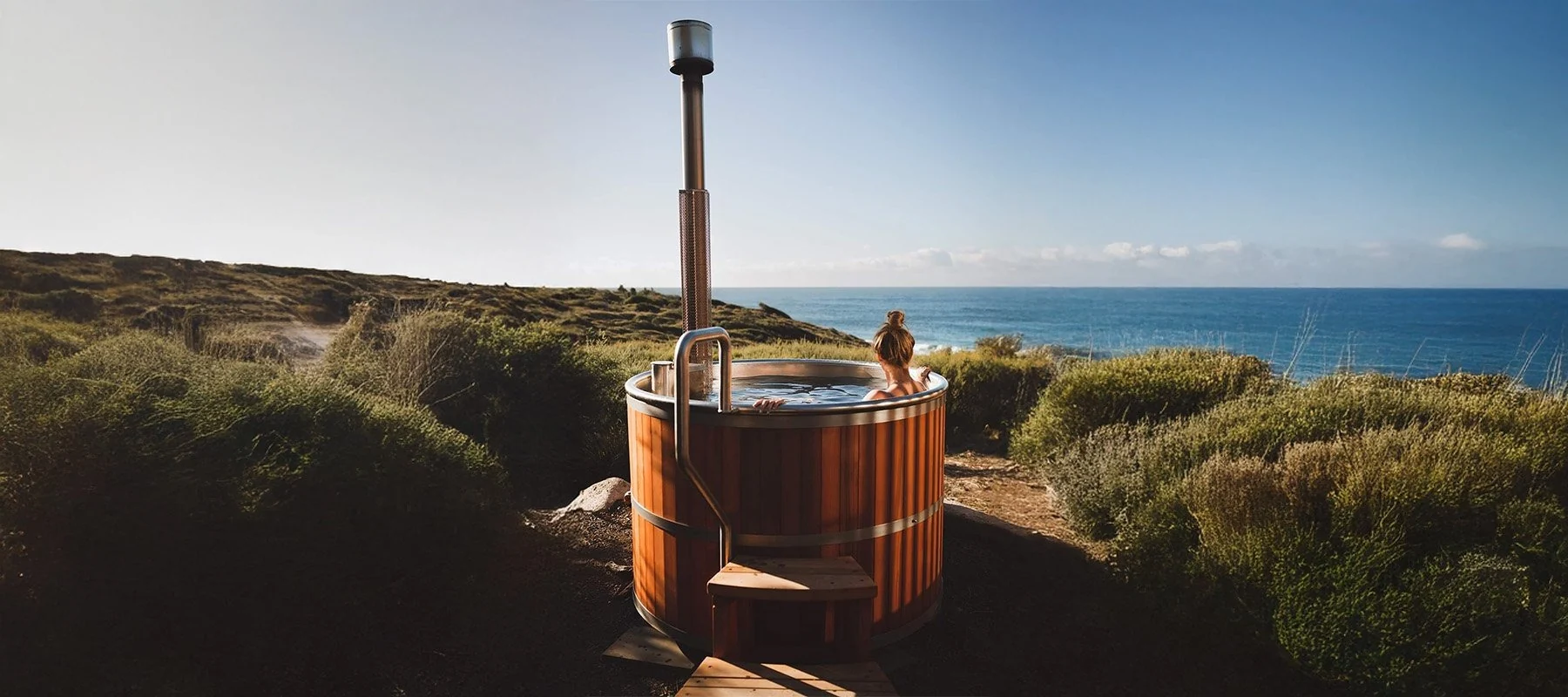 Wood-fired hot tub installed beside the ocean