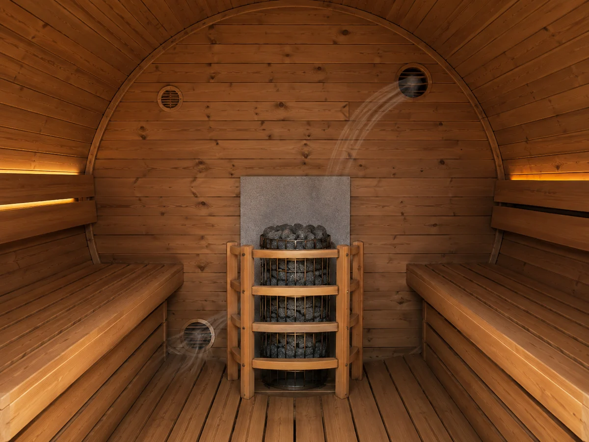 Electric heater guard and ventilation arrangement inside a barrel sauna