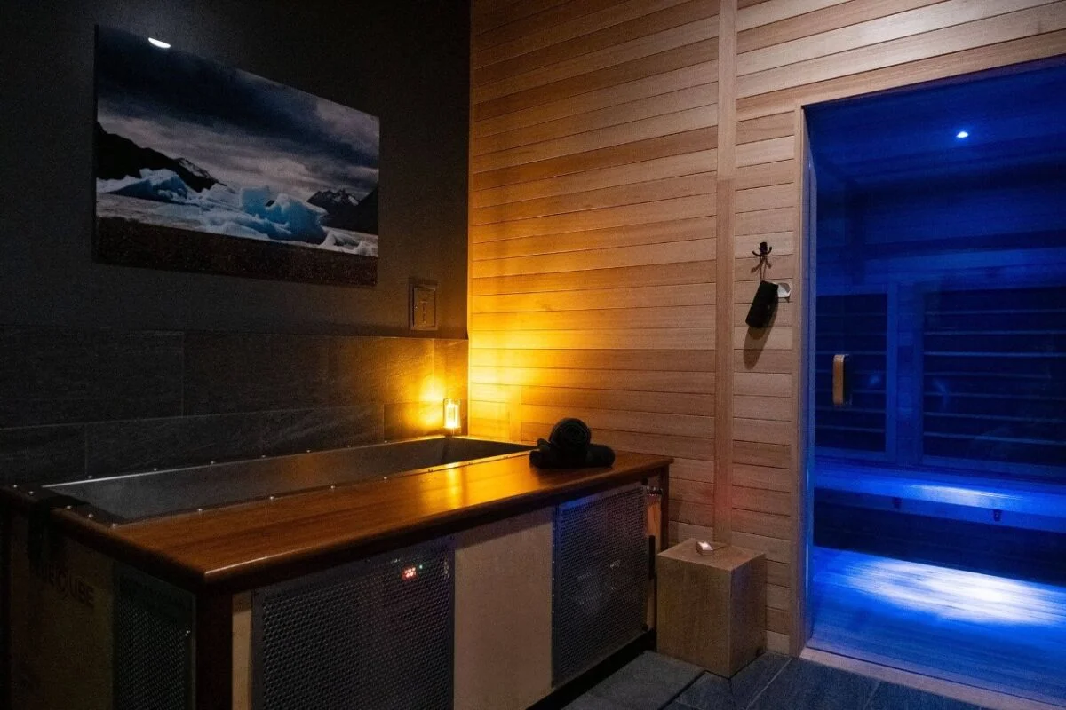 Sauna and cold plunge equipment in a contrast therapy studio