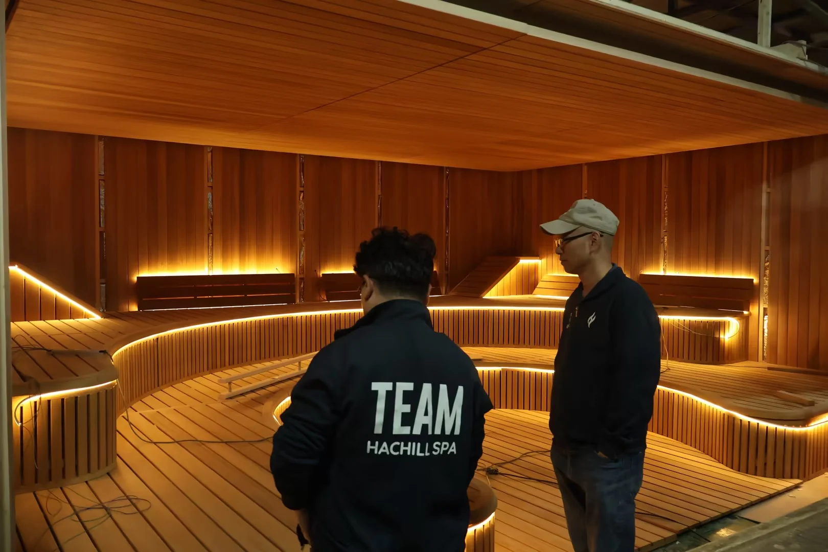 Project team inspecting a finished commercial sauna interior